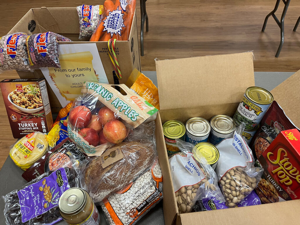 Boxes of assorted groceries on a table.