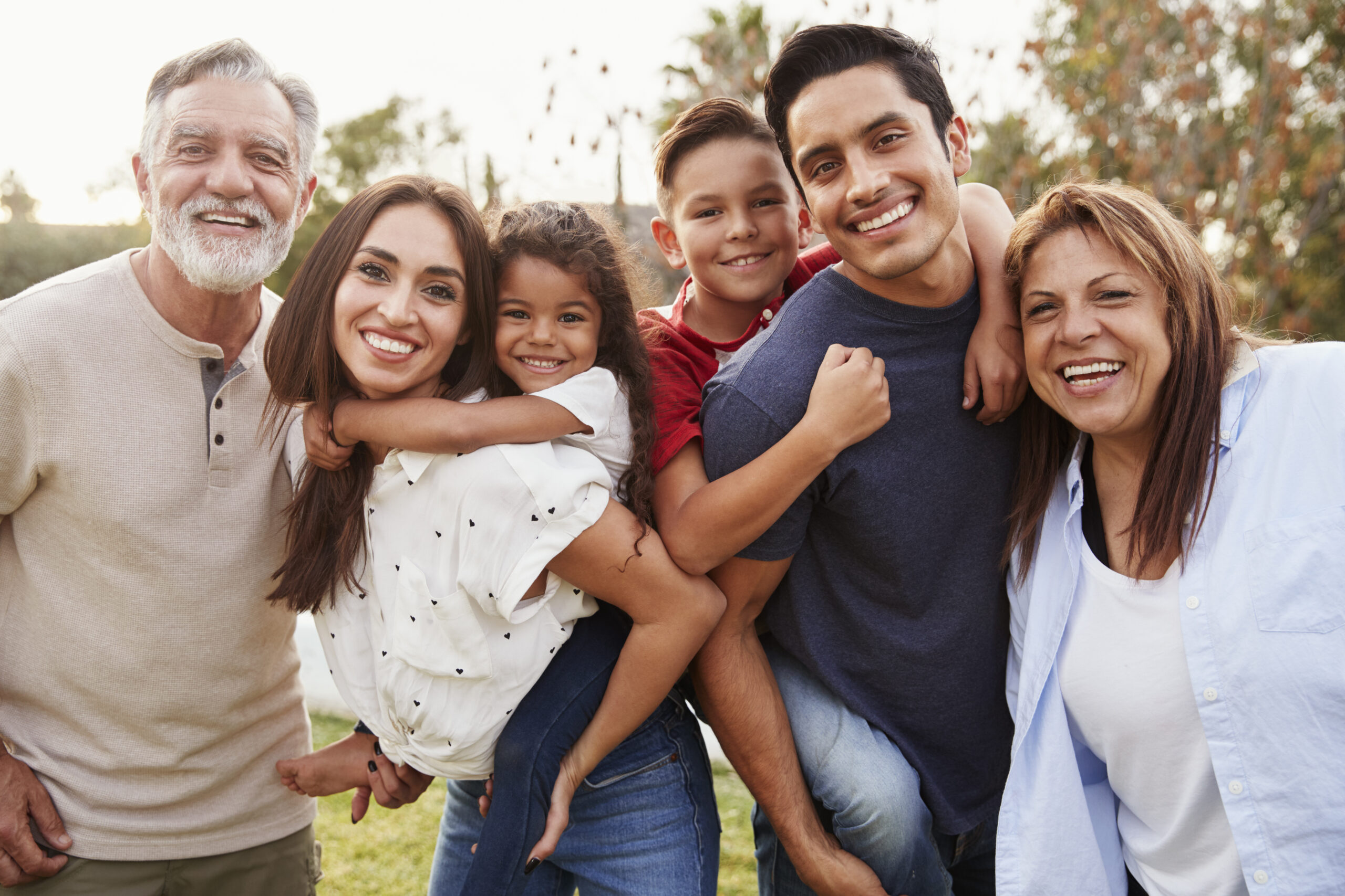 Happy family outdoors smiling together