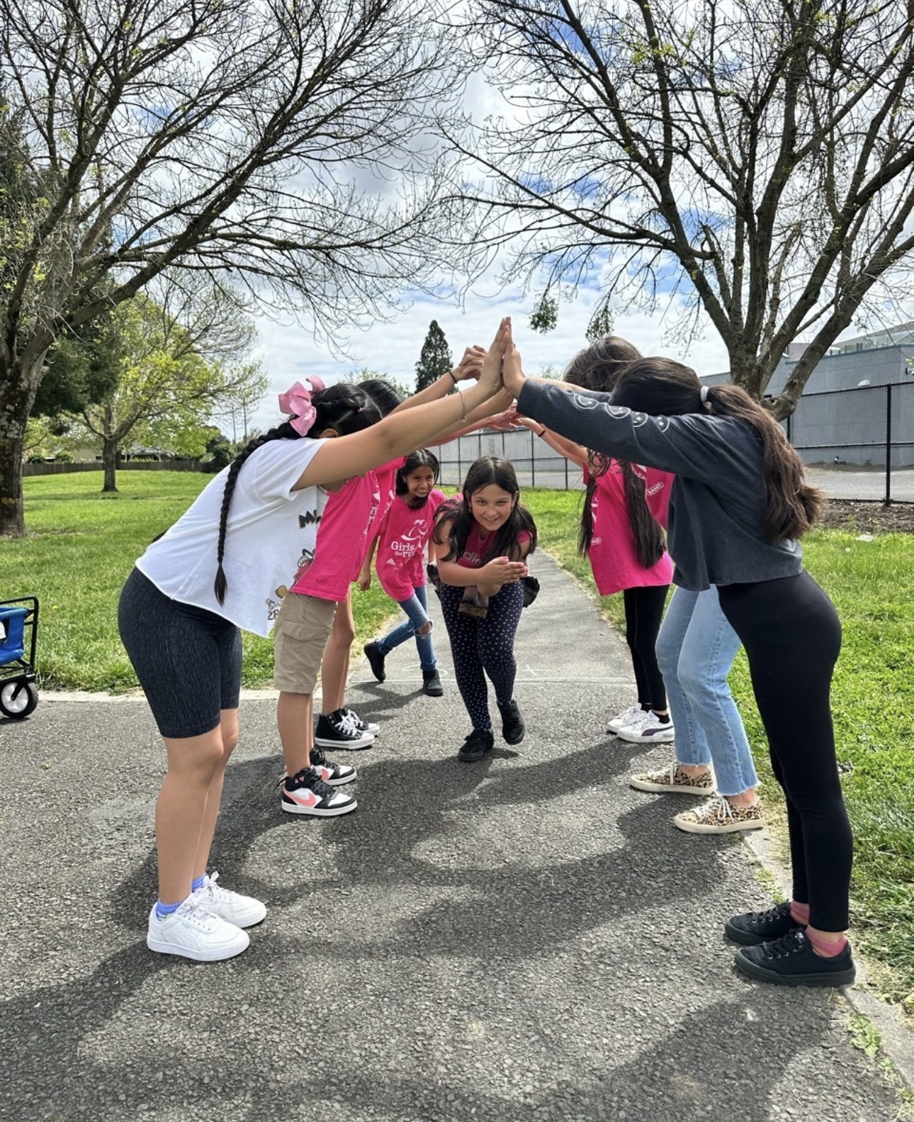 Children play a game outdoors, enjoying teamwork.